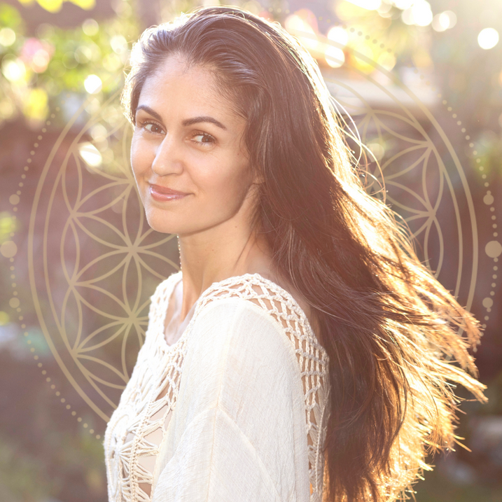 Sound Healing Hawaii, Reiki, Holistic Wellness - a music medicine women with long hair wearing a white top with sacred geometry flower of life in background